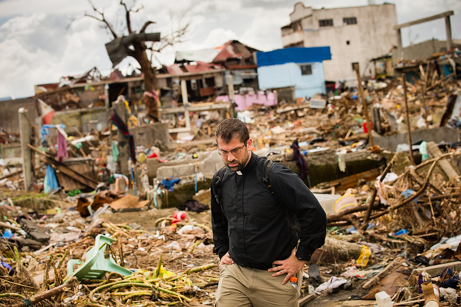 Rev. Ross Johnson, director of LCMS Disaster Response, surveys a debris field in Tacloban City, Leyte province, Philippines on Tuesday, Nov. 19, 2013. Typhoon Haiyan caused widespread destruction, killing thousands and displacing millions of people. Photo by Erik M. Lunsford/LCMS
