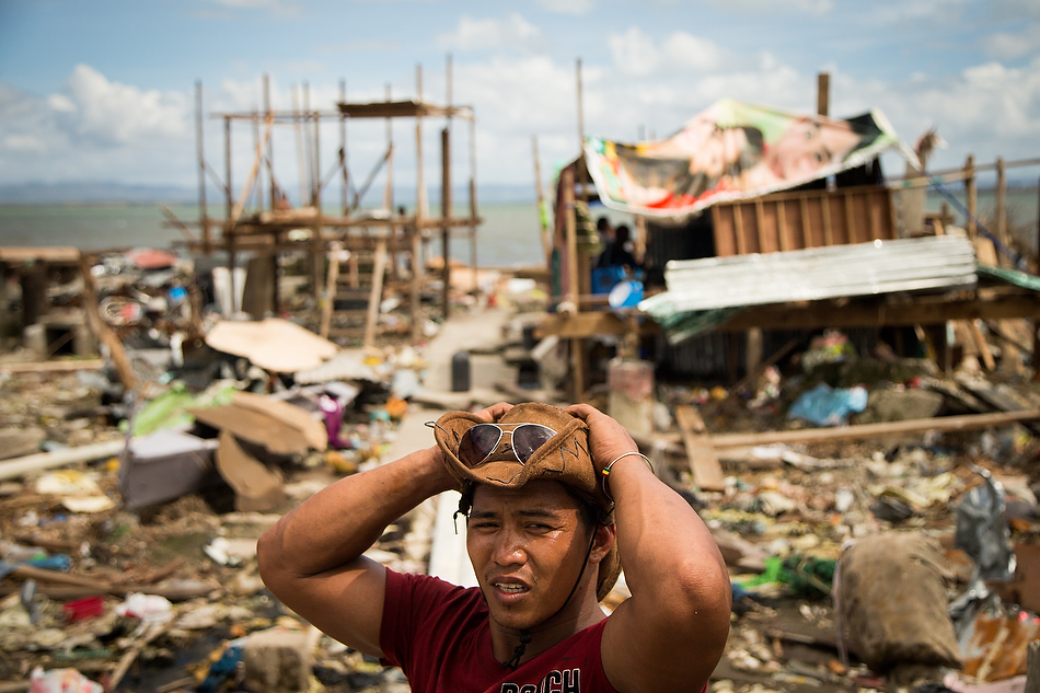 Resident Cris Megdue talks about his experiences during Typhoon Haiyan in Tacloban City, Leyte province, Philippines on Tuesday, Nov. 19, 2013. Typhoon Haiyan caused widespread destruction, killing thousands and displacing millions of people. Photo by Erik M. Lunsford/LCMS