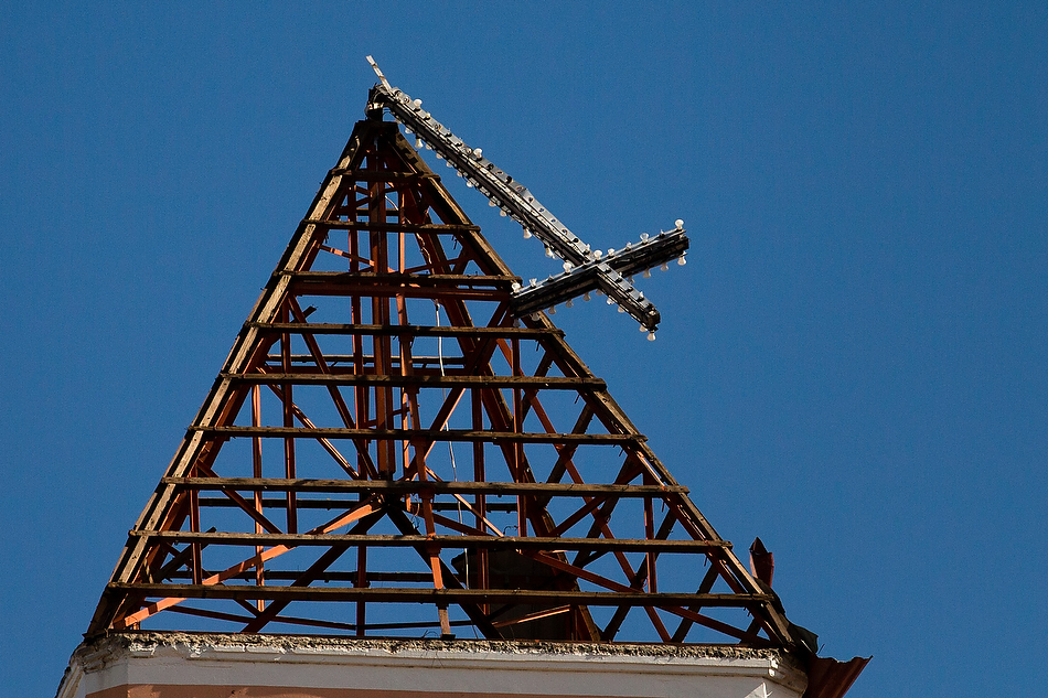 A toppled cross is seen in Tacloban City, Leyte province, Philippines on Tuesday, Nov. 19, 2013. The city and surrounding area were hit hardest by Typhoon Haiyan, leaving thousands dead and millions displaced. Photo by Erik M. Lunsford/LCMS