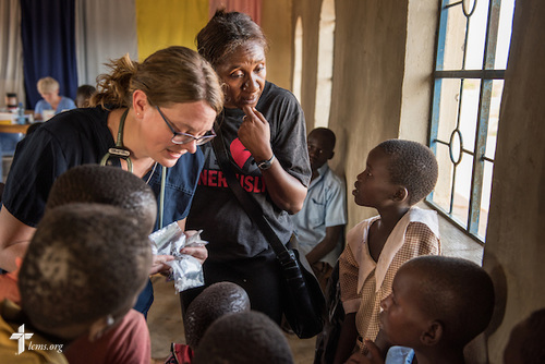 Shara Cunningham, career missionary in Eastern and Southern Africa, and Sarah Kanoy, an career missionary in East Africa, treat patients at the LCMS Mercy Medical Team on Monday, June 20, 2016, in Nataparkakono, a village in Turkana, Kenya. LCMS Communications/Erik M. Lunsford