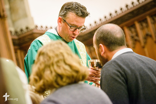 The Rev. Eric R. Andræ distributes the sacrament during worship at First Trinity EvangelicalLutheran Church on Sunday, Nov. 20, 2016, in Pittsburgh. LCMS Communications/Erik M. Lunsford