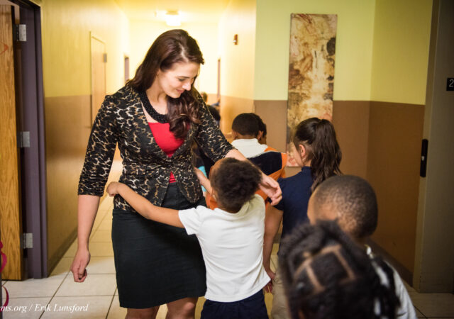 Principal Tiffany Venegas hugs students on their way to class at the Renaissance School, part of Lutheran Urban Mission Initiative, Inc., on Wednesday, May 20, 2015, in Mt. Pleasant, Wis. LCMS Communications/Erik M. Lunsford