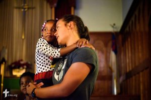 Kristin Boos carries Taniya Wimberly at the end of vacation Bible camp at East Bethlehem Lutheran Church, Detroit, Mich., on Wednesday, June 21, 2017, in Detroit. LCMS Communications/Erik M. Lunsford