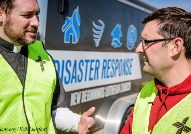 The Rev. Michael Meyer, manager of LCMS Disaster Response, talks to Travis Torblaa, mission and ministry director at New Beginnings Lutheran Church, Pacific, Mo., outside a destroyed home on Saturday, March 4, 2017, in Perryville, Mo. LCMS Communications/Erik M. Lunsford