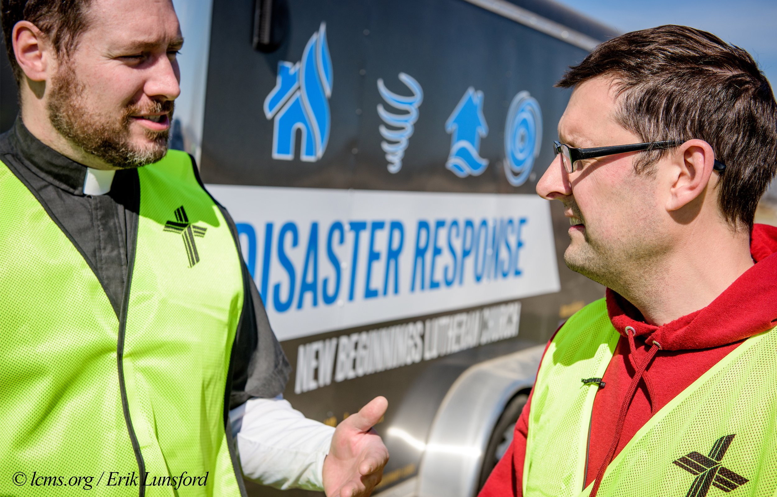 The Rev. Michael Meyer, manager of LCMS Disaster Response, talks to Travis Torblaa, mission and ministry director at New Beginnings Lutheran Church, Pacific, Mo., outside a destroyed home on Saturday, March 4, 2017, in Perryville, Mo. LCMS Communications/Erik M. Lunsford