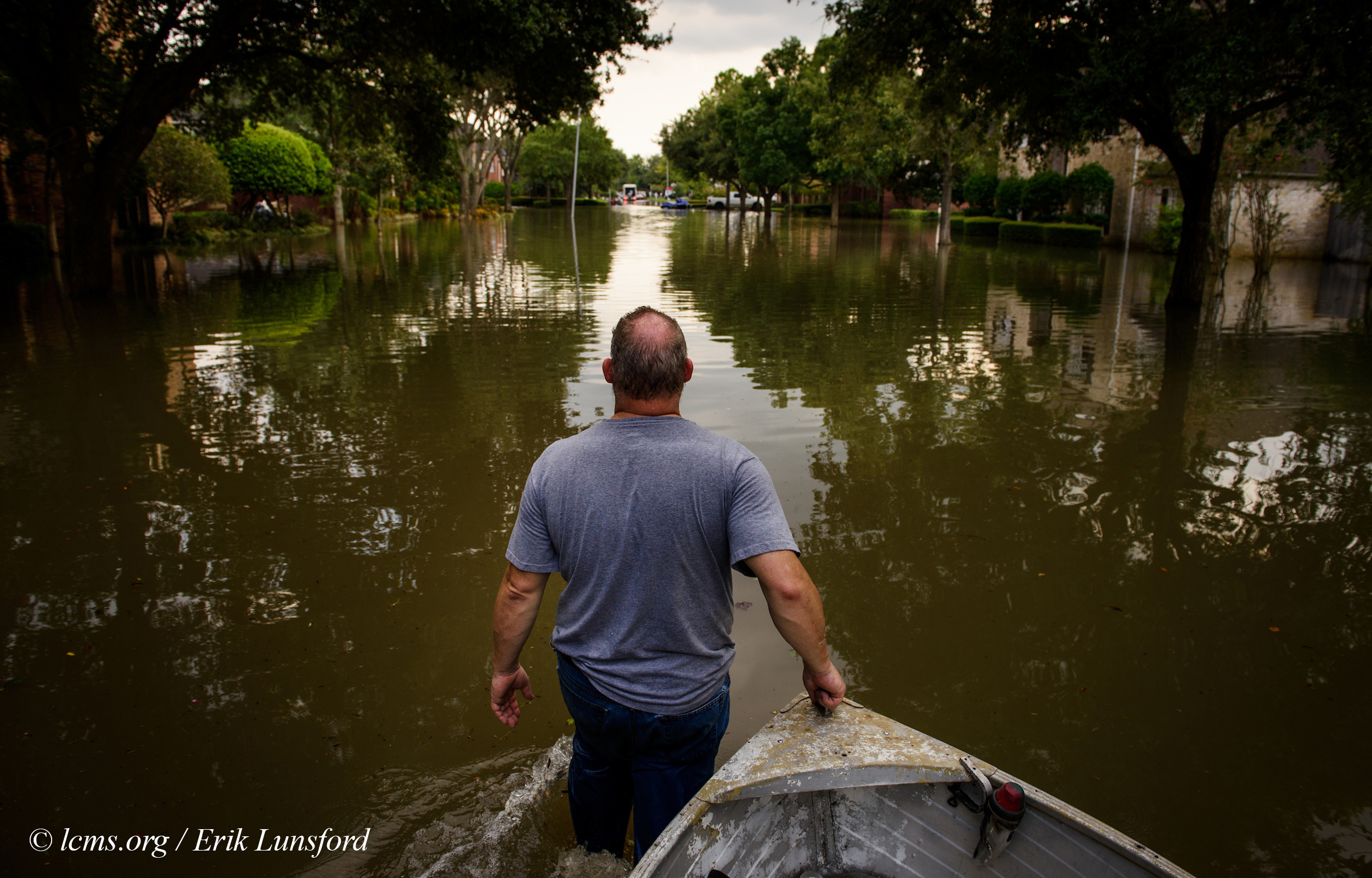 David Kunz of Memorial Lutheran Church, Houston, walks a boat through a flooded neighborhood on Monday, Sept. 4, 2017, in Houston. LCMS Communications/Erik M. Lunsford