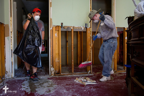 Erik Brown (left) and Eric Hollar, volunteers from Memorial Lutheran Church, Katy, Texas, clear debris at a home damaged by Hurricane Harvey on Friday, Sept. 1, 2017, in Katy. LCMS Communications/Erik M. Lunsford