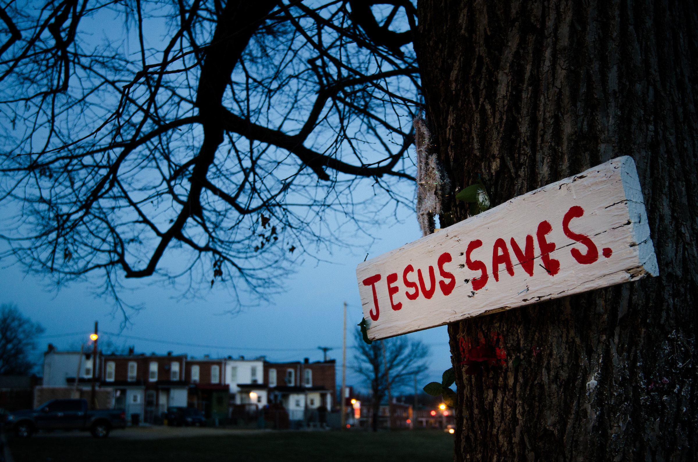 A sign nailed to a tree punctuates the dusk Thursday, March27, 2014, outside a neighborhood in Baltimore, Md. LCMS Communications/Erik M. Lunsford