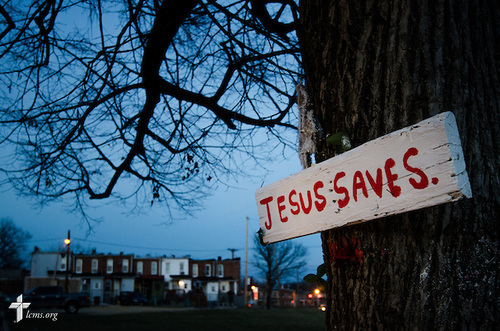 A sign nailed to a tree punctuates the dusk Thursday, March27, 2014, outside a neighborhood in Baltimore, Md. LCMS Communications/Erik M. Lunsford