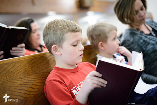 Joshua Nierman, son of the Rev. Mark Nierman, pastor of Mount Olive Lutheran Church, sings with his family during Lenten worship on Wednesday, March 2, 2016, in Loveland, Colo. LCMS Communications/Erik M. Lunsford