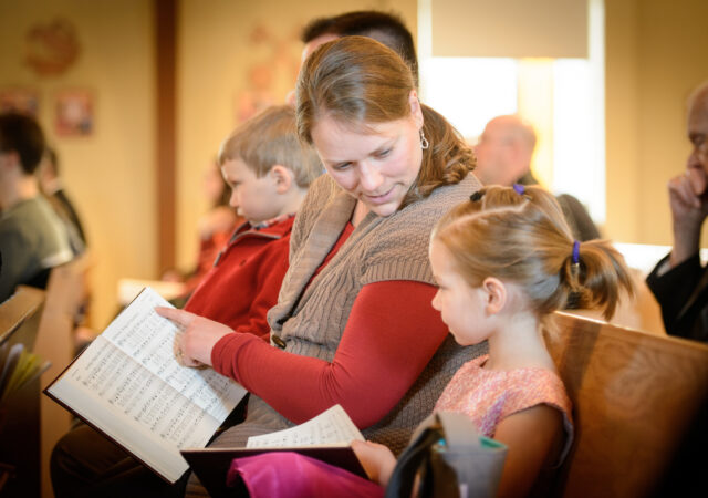 Laurie Vogt leads her daughter Abigail Vogt in the Lutheran Service Book during worship on Transfiguration Sunday, Feb. 7, 2016, at Peace Lutheran Church in Sussex, Wis., LCMS Communications/Erik M. Lunsford