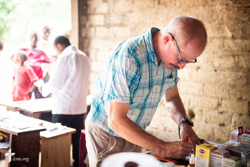 The Rev. Gary Schulte, area director for West and Central Africa, works in the pharmacy on the third day of the LCMS Mercy Medical Team on Wednesday, May 9, 2018, in the Yardu village outside Koidu, Sierra Leone, West Africa. LCMS Communications/Erik M. Lunsford
