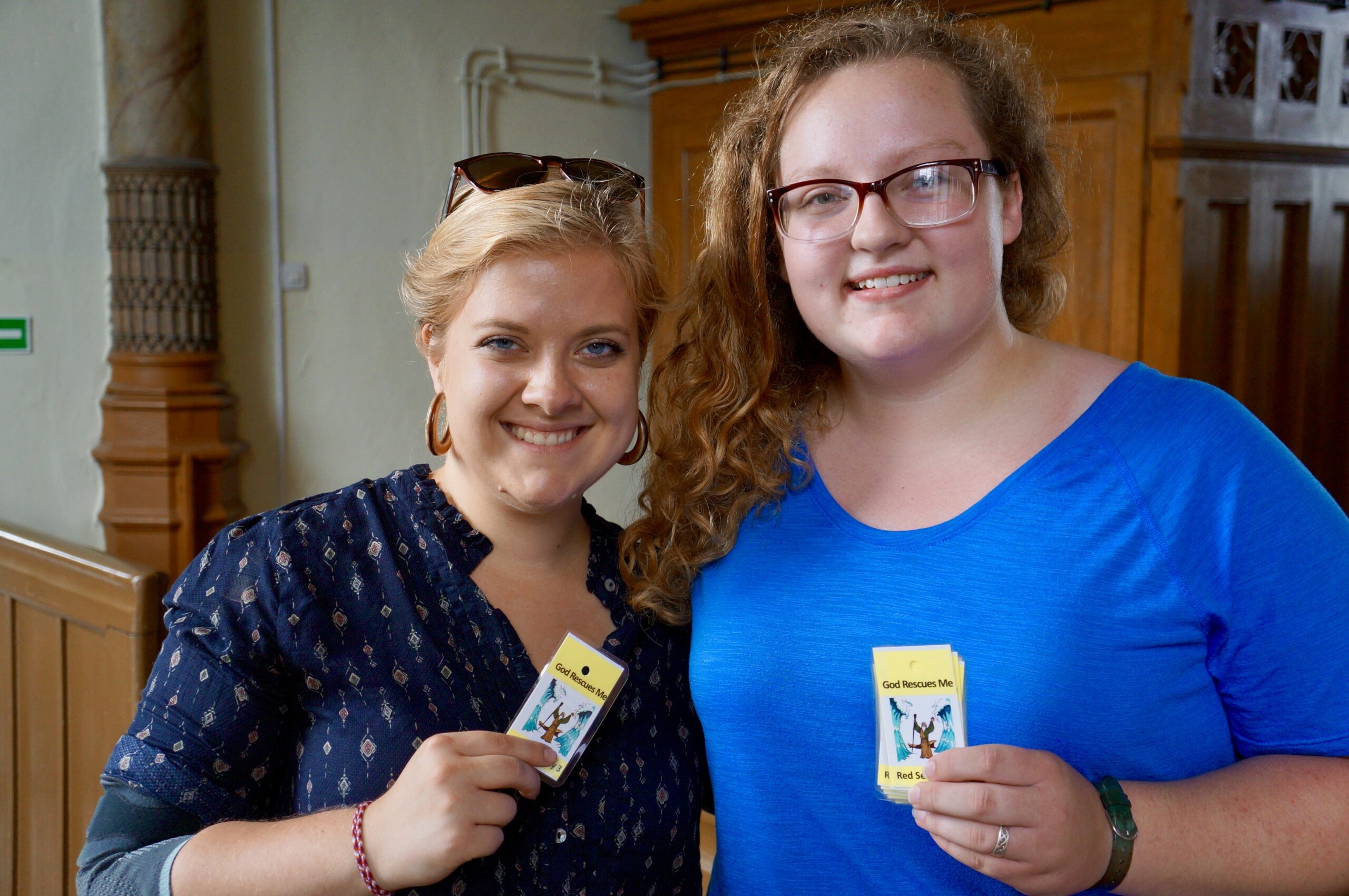 Photo: GEO Missionary Sarah Harms and a teen from Immanuel Lutheran Church in Broken Arrow, OK, hold up the “take home” cards for the day of “God Rescues Me” at an Engligh Bible Camp in Poland. LCMS/Benjamin Helge Used with permission.