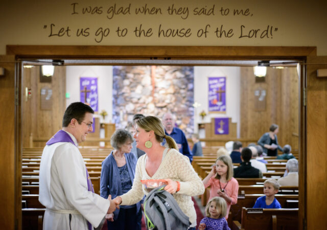 The Rev. Mark Nierman, pastor of Mount Olive Lutheran Church, greets parishioner Shelley Haagenson and her three children, Delaney, Bella, and Oliver, after Lenten worship on Wednesday, March 2, 2016, in Loveland, Colo. LCMS Communications/Erik M. Lunsford