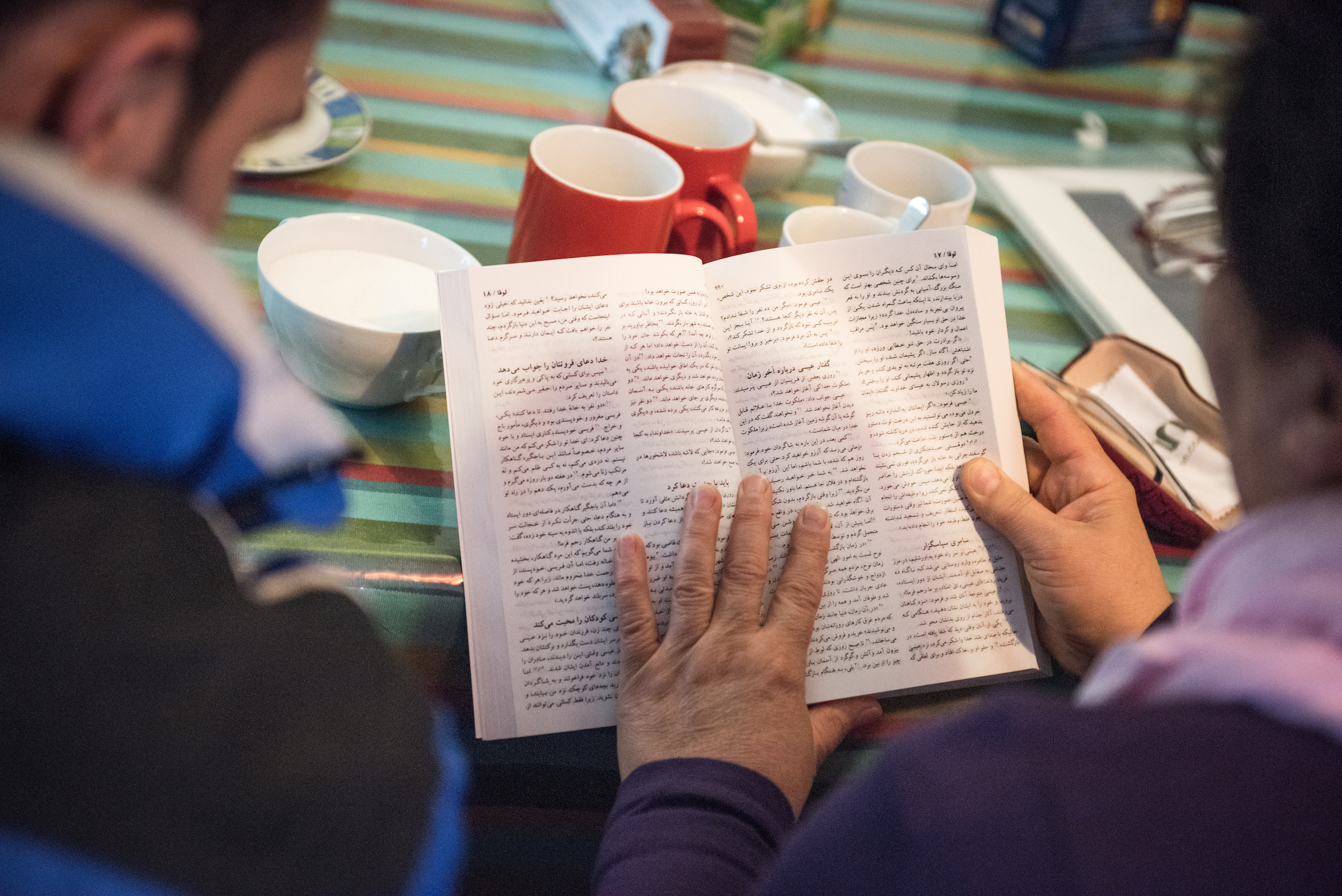Christian refugees read from a translated Bible during a Bible study on Friday, Nov. 13, 2015, near the Evangelisch-Lutherische St. Trinitatisgemeinde, a SELK Lutheran church in Leipzig, Germany. LCMS Communications/Erik M. Lunsford