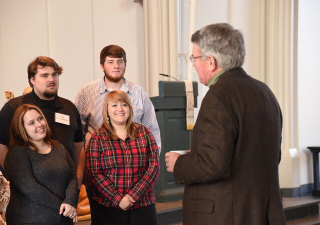 Rev. Dr. Dale Meyer speaks to Green and Gold Day participants.