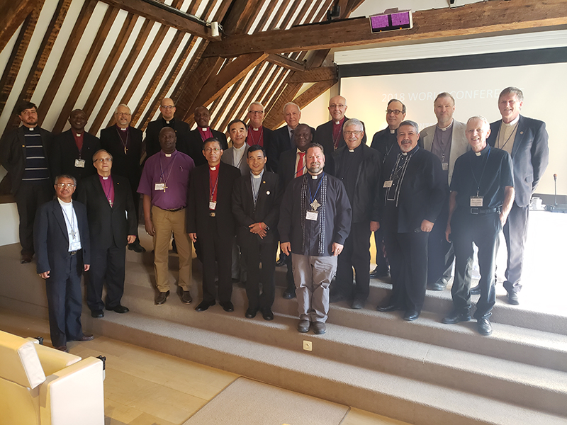The International Lutheran Council’s Executive Committee pose with representatives of new member churches. Used with permission