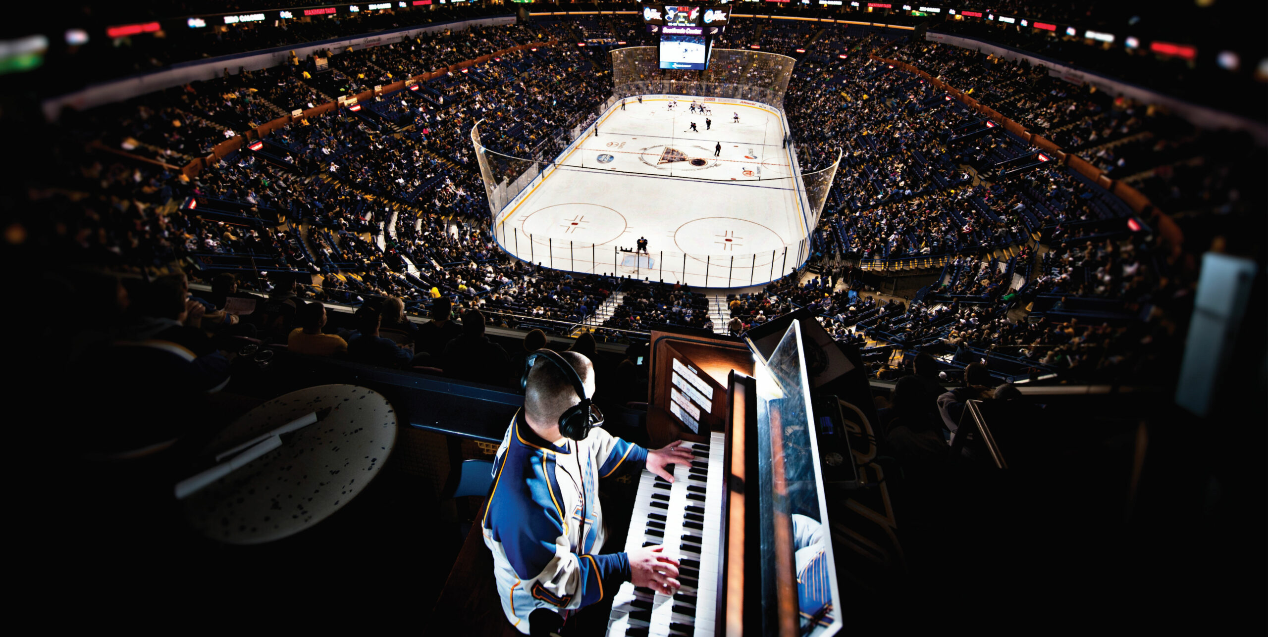 Jeremy Boyer, organist for the St. Louis Blues, watches a play during a Blues game. Used with permission.