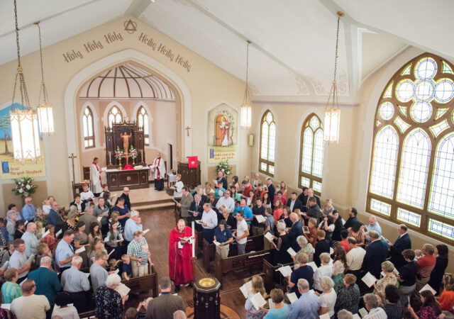 The Rev. Benjamin Ball blesses the baptismal font during a Divine Service of Rededication at St. Paul Lutheran Church in Hamel, Ill., on Sunday, Sept. 7, 2014. LCMS Communications/Erik M. Lunsford