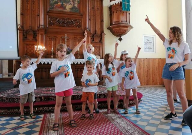 Katie Scherger, Short-term volunteer for the English Bible Camp in Konin, Poland, in August 2019, sings songs with campers.