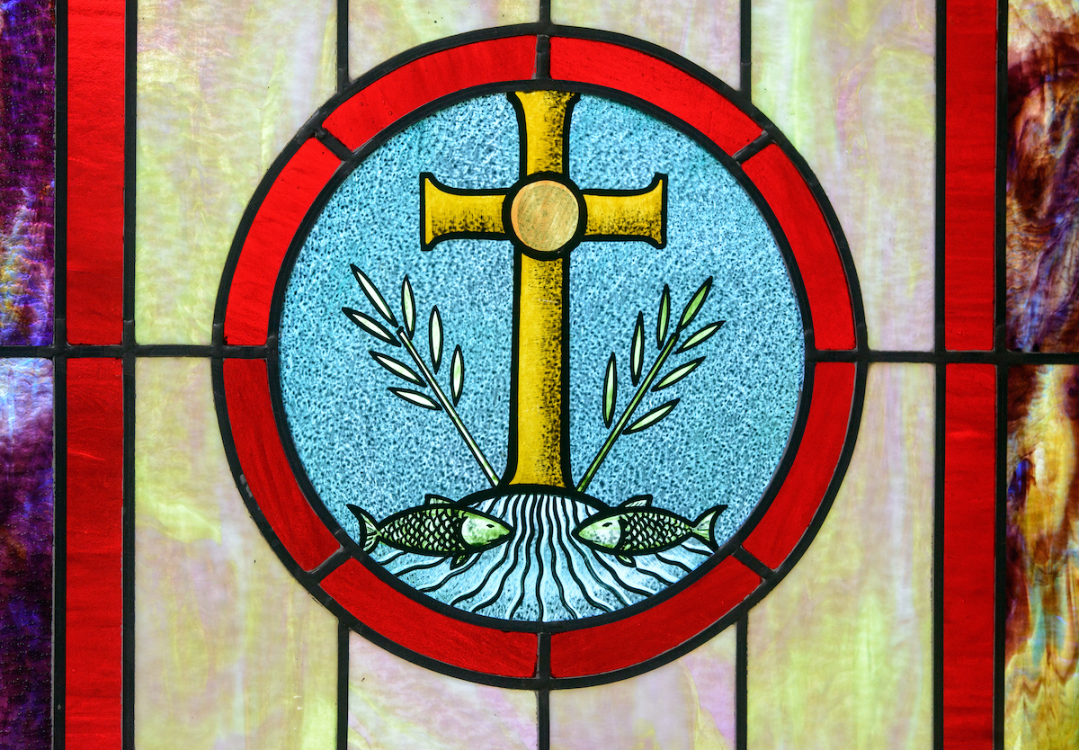 Stained glass depicting the cross at Zion Evangelical Lutheran Church, Lu Verne, Iowa, on Sunday, July 9, 2017. LCMS Communications/Erik M. Lunsford