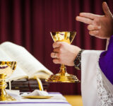 The Rev. Matthew Wood consecrates the elements during worship on Wednesday, March 20, 2019, in Chiayi City, Taiwan. LCMS Communications/Erik M. Lunsford