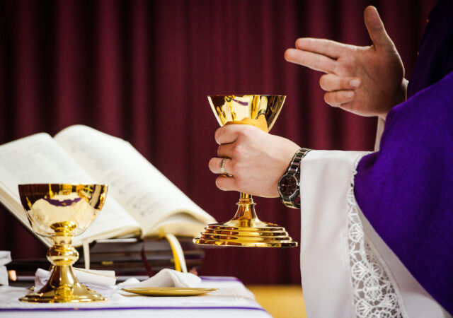 The Rev. Matthew Wood consecrates the elements during worship on Wednesday, March 20, 2019, in Chiayi City, Taiwan. LCMS Communications/Erik M. Lunsford
