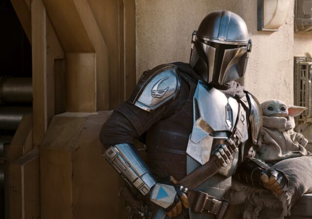 The Mandalorian (Pedro Pascal) and the Child in THE MANDALORIAN, season two, exclusively on Disney+