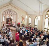 The Rev. Benjamin Ball blesses the baptismal font during a Divine Service of Rededication at St. Paul Lutheran Church in Hamel, Ill., on Sunday, Sept. 7, 2014. LCMS Communications/Erik M. Lunsford
