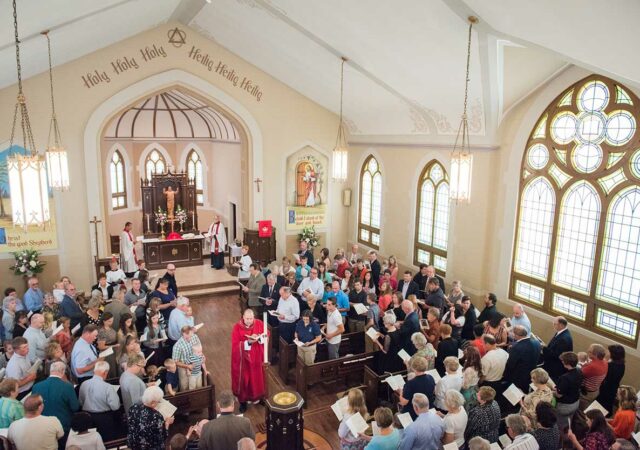 The Rev. Benjamin Ball blesses the baptismal font during a Divine Service of Rededication at St. Paul Lutheran Church in Hamel, Ill., on Sunday, Sept. 7, 2014. LCMS Communications/Erik M. Lunsford