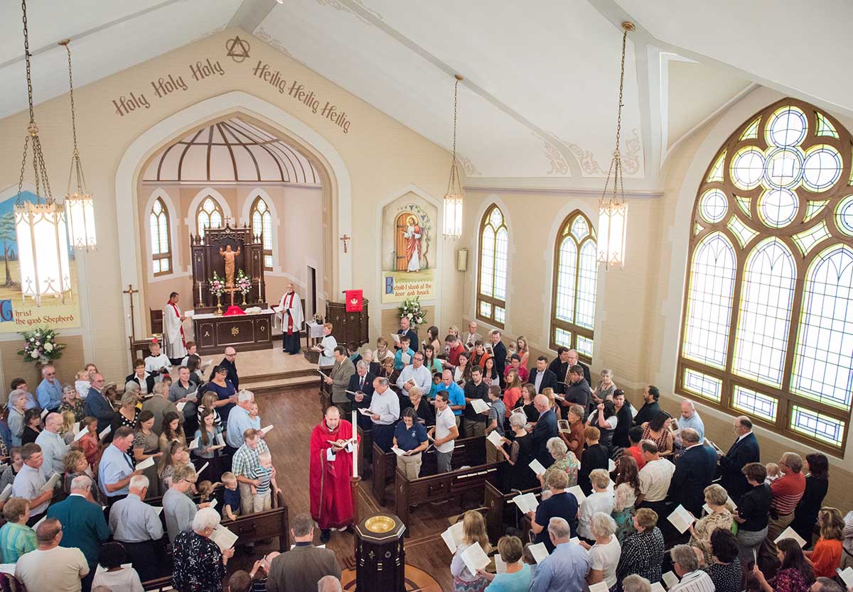 The Rev. Benjamin Ball blesses the baptismal font during a Divine Service of Rededication at St. Paul Lutheran Church in Hamel, Ill., on Sunday, Sept. 7, 2014. LCMS Communications/Erik M. Lunsford